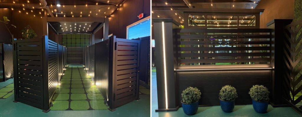 Black horizontal aluminum fence panels and an aluminum privacy fence on display at the Lumina showroom in Panorama City